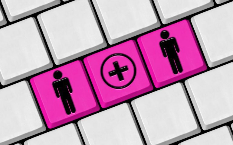Bride and groom buttons on a keyboard with online wedding RSVP